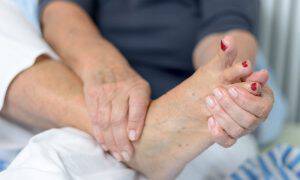 bigstock-Senior-Lady-Massaging-Her-Foot-95718701