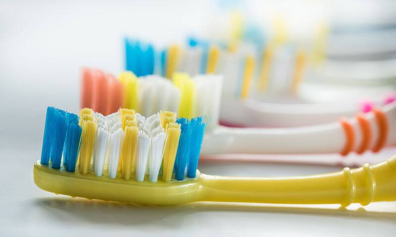 bigstock-Colorful-Toothbrushes-Are-Very-119136920