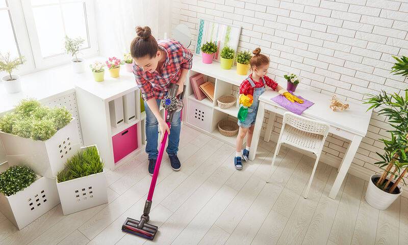 bigstock-Happy-family-cleans-the-room-121920704