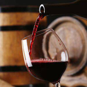 bigstock-Pouring-red-wine-from-bottle-i-90032456