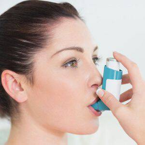 bigstock-Woman-having-asthma-using-the-40893925