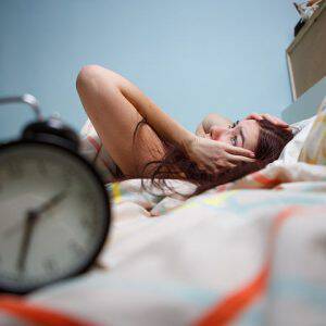 bigstock-Woman-with-insomnia-touching-h-122226026