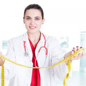 bigstock-Young-Woman-Doctor-Holding-Mea-149077853